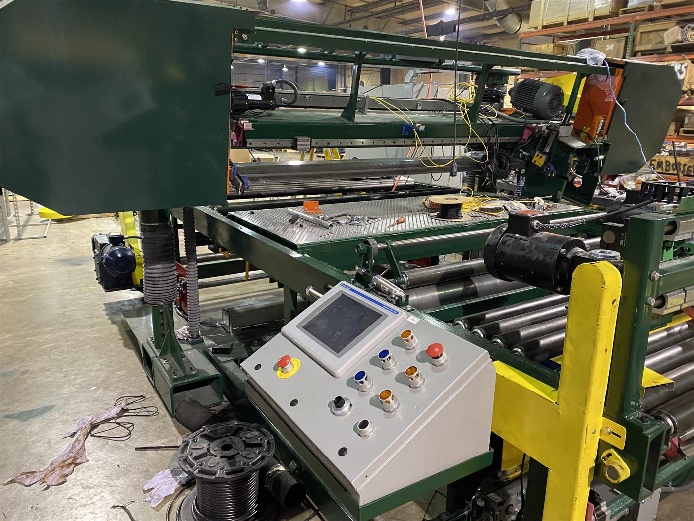Custom-built horizontal bandknife machine with operator control station on the plant floor